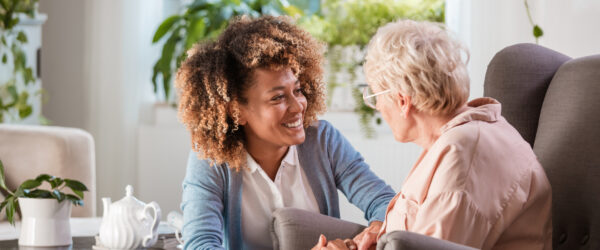 Carer supporting an eldery lady