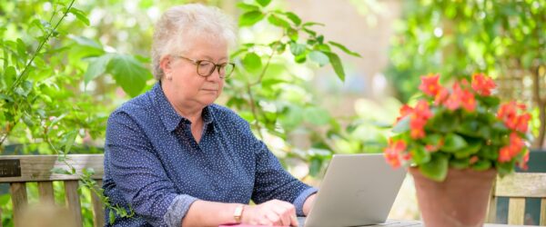 Older lady researching live-in care costs