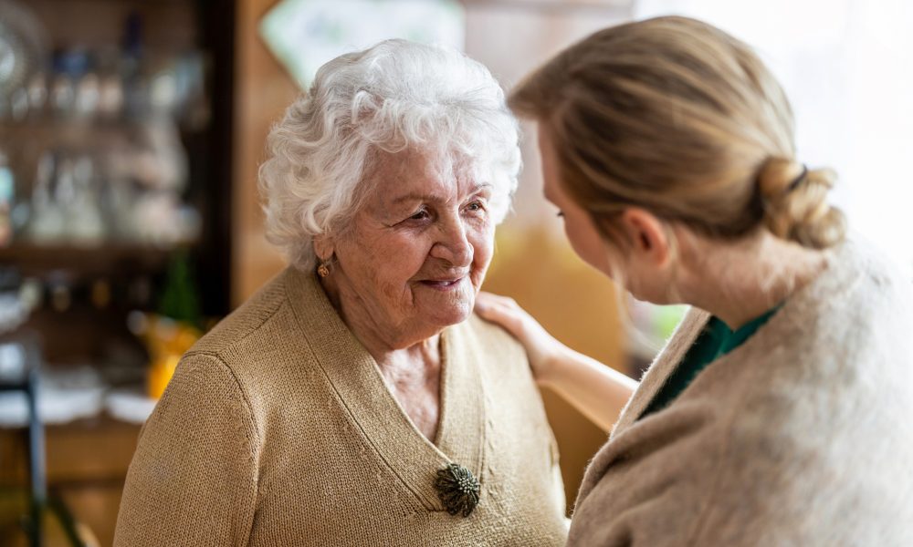 Carer talking to senior lady