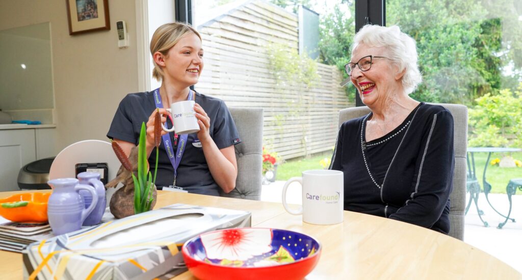 Carer chatting with elderly lady