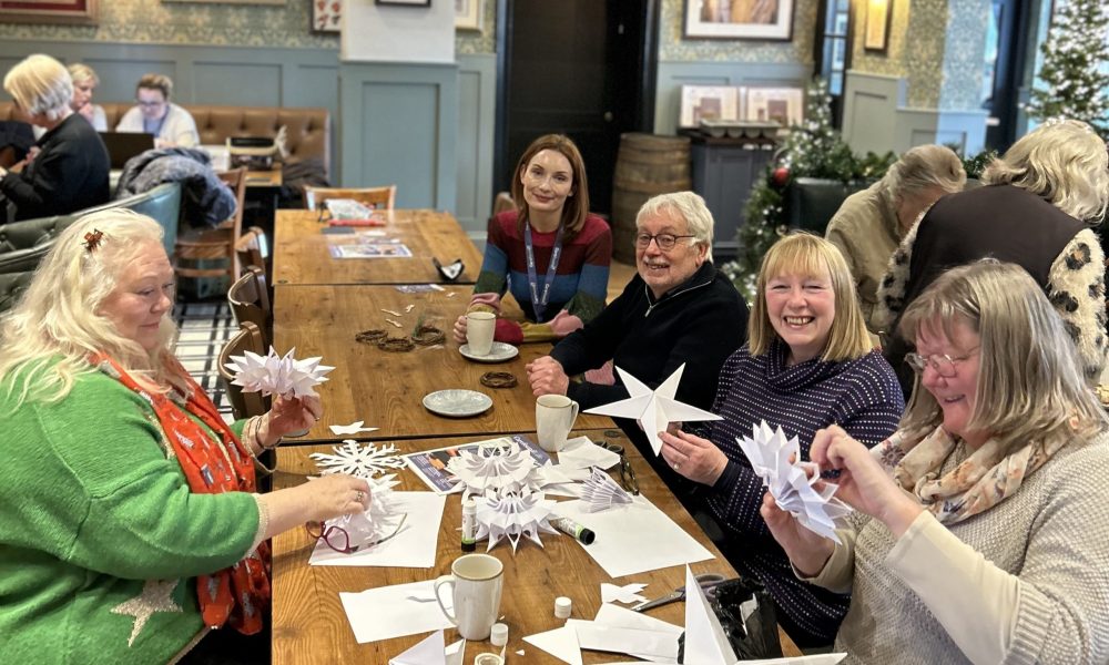 Attendees enjoying Christmas crafts at Carefound Home Care’s coffee morning