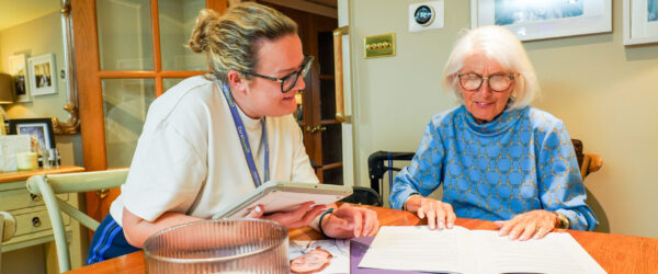 Care manager giving care advice in kitchen