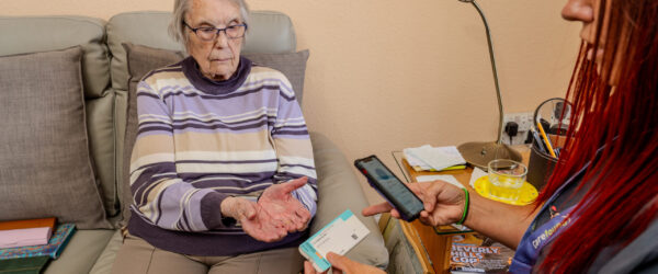 Care professional using care managament app