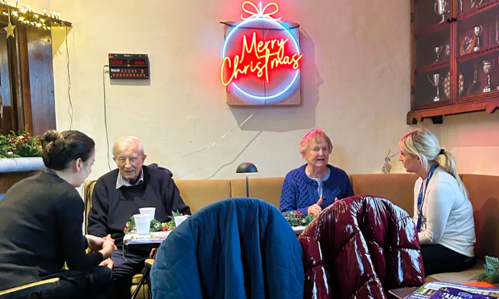 Guests enjoying a coffee and a chat at Carefound Home Care’s White Christmas coffee morning in Ripley