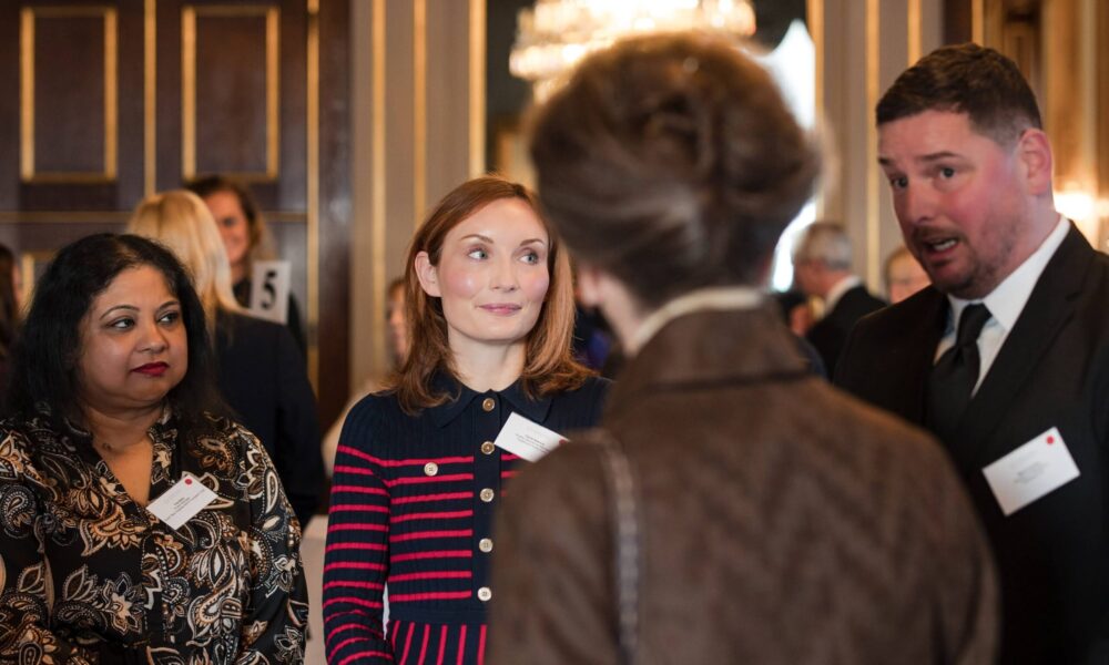 Claire Spence (centre), Quality Assurance Manager at Carefound Home Care, discussing the award with HRH The Princess Royal