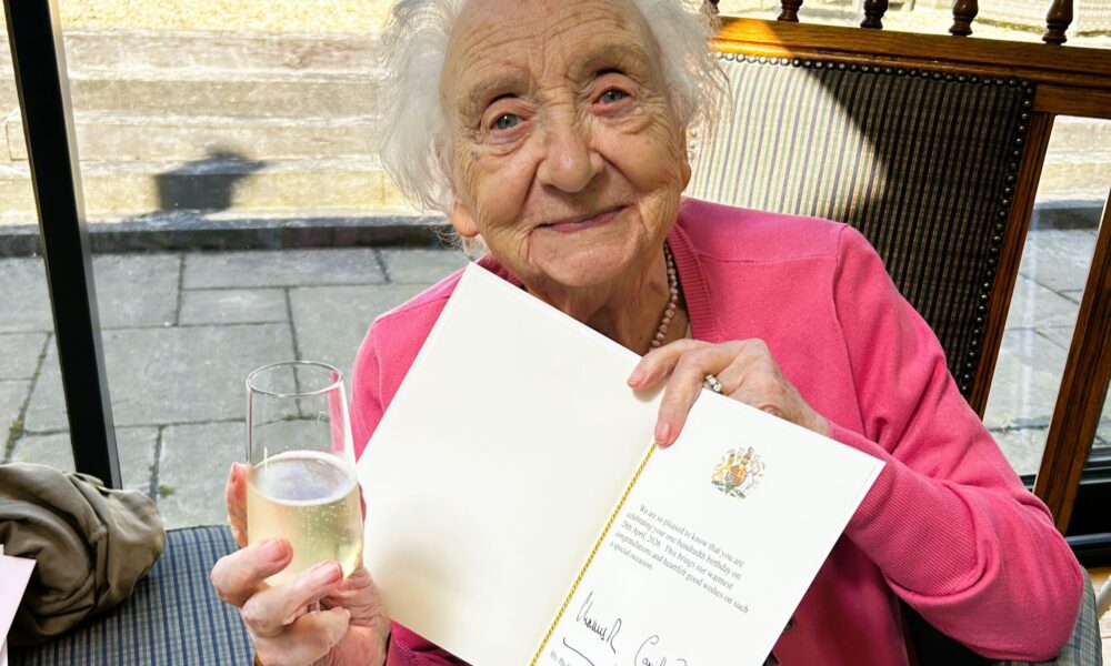 Elderly lady in Nottinghamshire celebrating turning 100 with card from the King and Queen